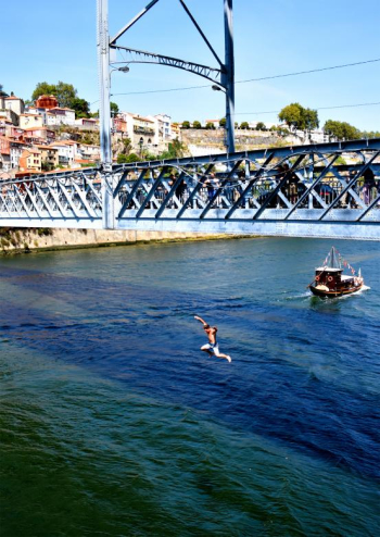 Boy Jumping Off the Bridge Into Douro River