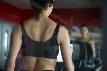 a woman is training inside the gym club