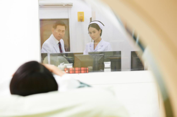 a picture of a doctor and a nurse looking and checking the patient
