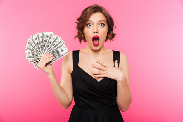 caucasian,showing,paying,attractive,cheerful,excited,banknote,deposit,wealth,standing,income,benefit,pretty,adult,holding,businesswoman,successful,rich,saving,currency,happiness,bill,professional,young,female,cash,payment,win,dollar,lady,finance,winner,success,happy,shopping,woman,money,business