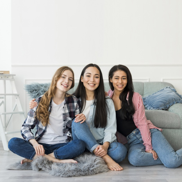 multiethnic,multiracial,square format,looking at camera,copy space,carefree,indoors,hispanic,posing,format,embrace,casual,hugging,wear,looking,copy,smiling,pretty,adult,positive,teen,international,lifestyle,sitting,beautiful,asian,best,young,together,female,jeans,youth,girls,friend,friendship,sofa,group,floor,fun,square,room,happy,hipster,space,student,girl,camera,woman,people