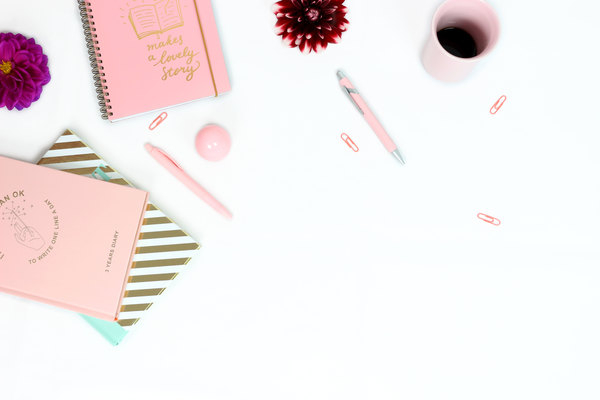 workplace,desk,feminine,notes,notebooks,diary,pens,pink cup,pink diary,gold diary,striped diary,dahlia,flowers,paper clip,pink paper clip,girly,purple,pink,gold,golden,white background,flat lay,cup of coffee,turquoise,red dahlia,pocketbook,write