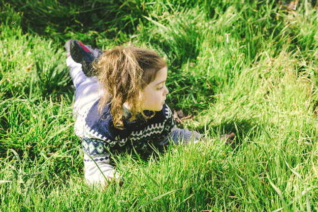 Download Girl lying on grass and looking away FREE in PHOTO format and disc...