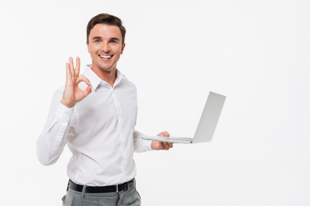 showing,relaxed,joyful,attractive,casual,handsome,mobility,standing,adult,holding,gesture,joy,male,surfing,portrait,young,ok,show,pc,success,businessman,person,notebook,internet,shirt,web,happy,smile,laptop,man,camera,education,computer,hand,technology,people,business
