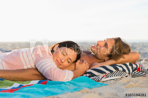 serene,couple,relax,sunny,beach,woman,man,adult,mid,young,caucasian,husband,wife,boyfriend,girlfriend,together,smile,happiness,enjoy,bonding,half face,lay,waist up,leisure,lifestyle,travel,vacation,summer,well-being,serene people,love,affection,blanket,sand,outdoors,day,people,2,pair,copy space,adobestock