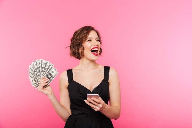 ecstatic,demonstrate,caucasian,showing,bunch,paying,excitement,attractive,cheerful,excited,banknote,wealth,income,luck,adult,holding,businesswoman,speaking,saving,currency,bill,buy,professional,young,female,cash,payment,lady,bank,winner,success,happy,mobile,shopping,phone,woman,money